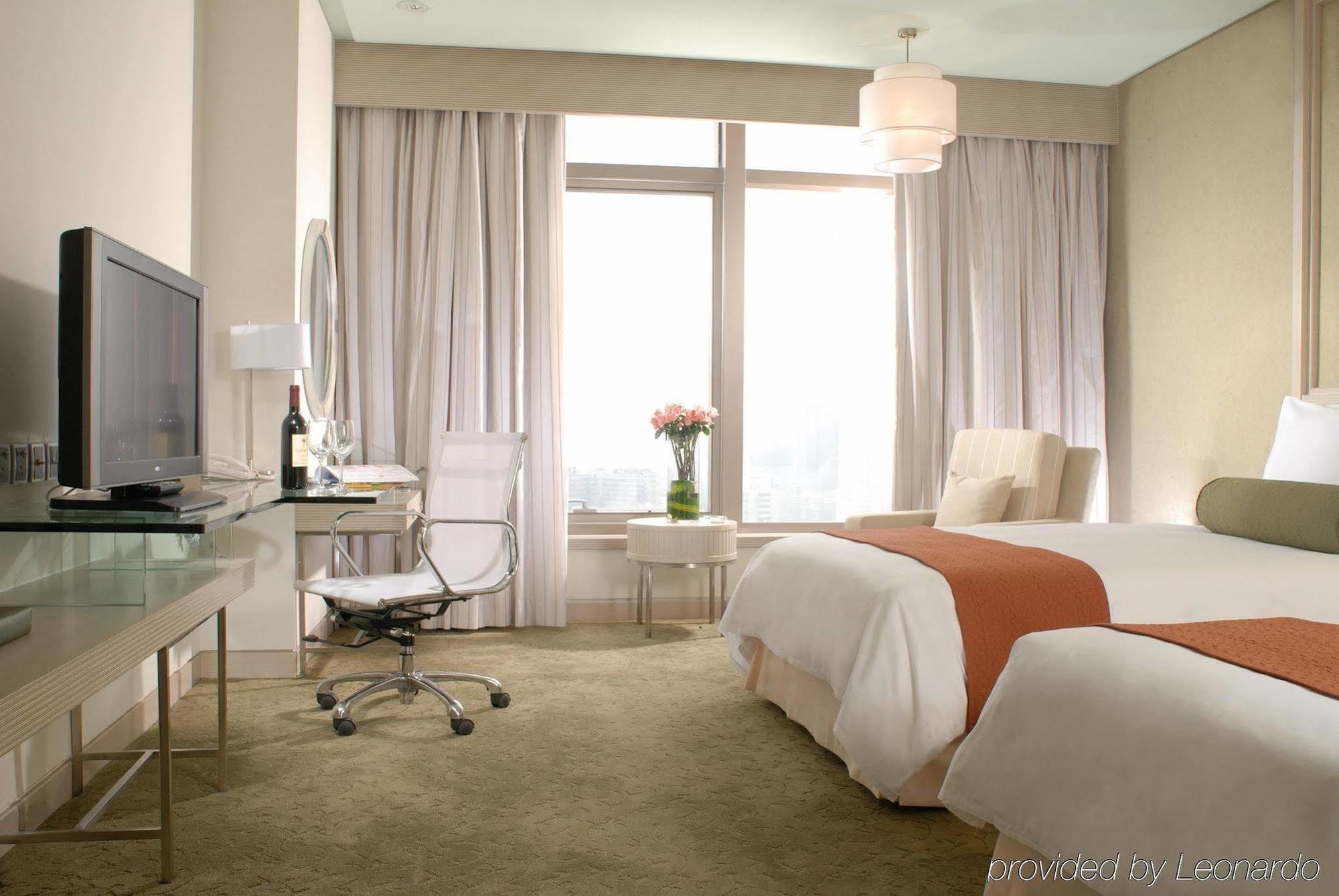 Hotel Nikko Тяньцзінь Номер фото A room at the hotel